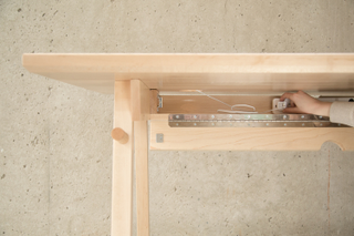 Illustration for article titled This Desk Keeps Your Cords In Order and Has a Built-In Whiteboard
